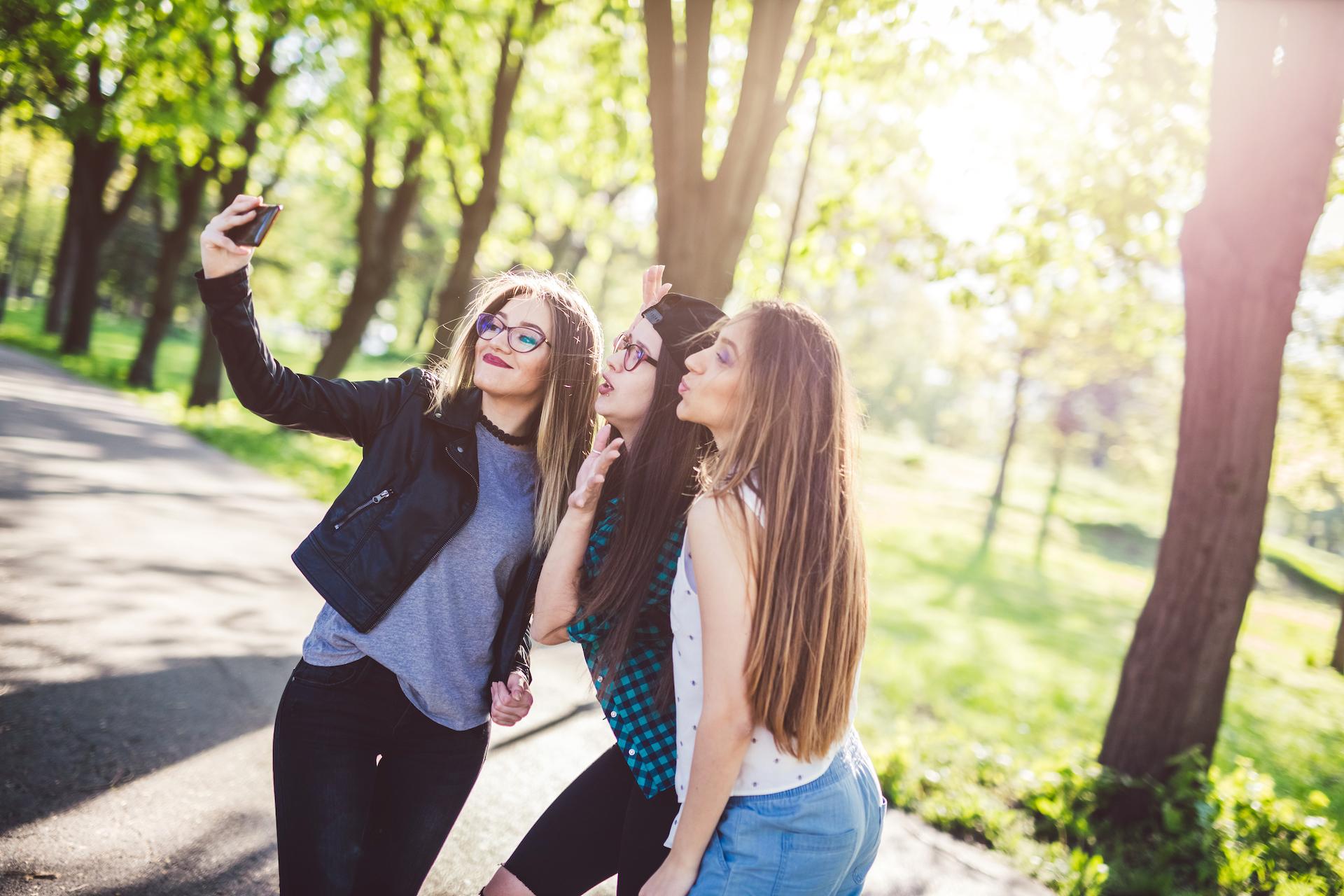 Girls taking selfie showing positive effects of social media