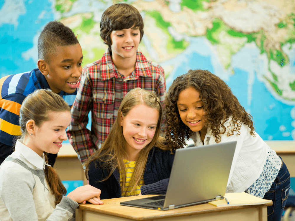Image of group of children infront of a laptop